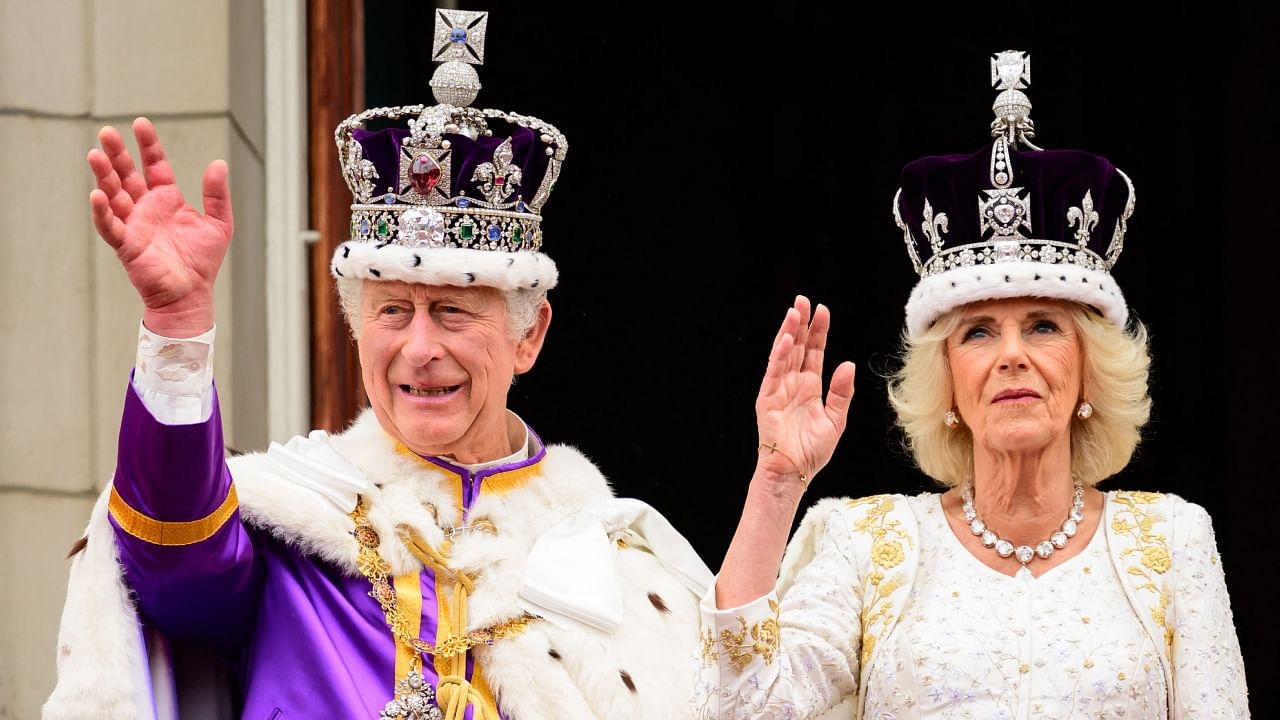 Britain's King Charles III and Queen Camilla wave from the Buckingham Palace balcony, in London, following their coronations, on May 6, 2023. Credit: AFP Photo