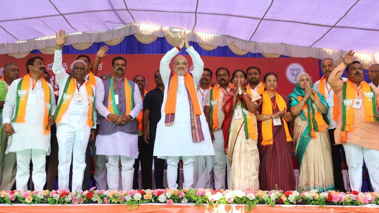 Amit Shah during campaign rally for BJP candidate from Savadatti-Yallamma assembly constituency Ratna Mamani at Savadatti town in Belagavi. Credit: DH Photo