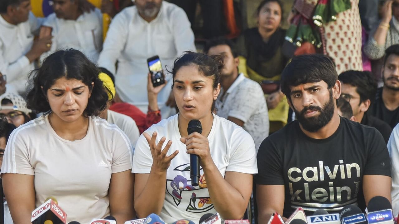 Bajrang Punia, Vinesh Phogat and Sakshi Malik address a press conference during their protest at Jantar Mantar in New Delhi, Saturday, May 6, 2023. Credit: PTI Photo