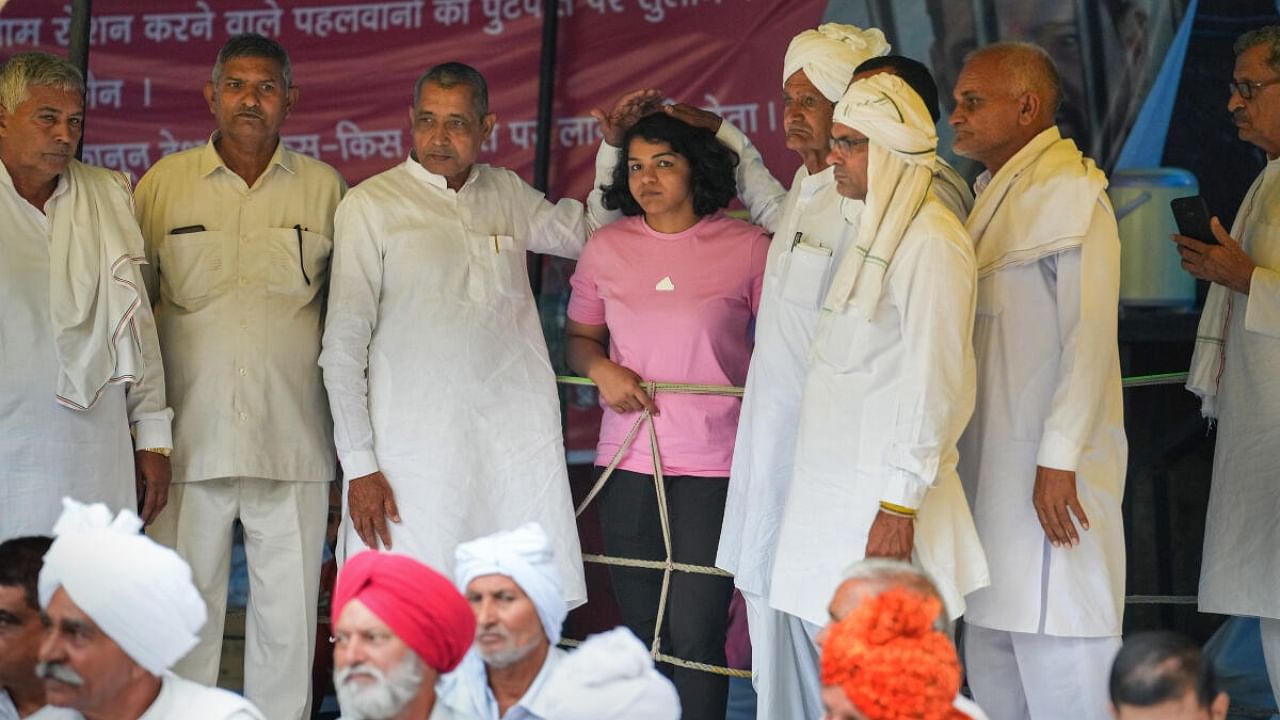 Members of Khap Panchayat with wrestler Sakshi Mallik during the wrestlers' protest at Jantar Mantar, in New Delhi, Monday, May 1, 2023. Credit: PTI Photo