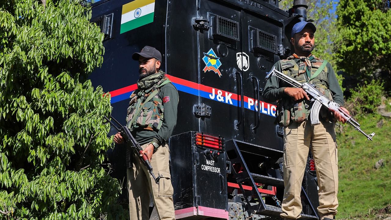 Security personnel near the site of an encounter with terrorists in the Kandi area of Rajouri district, Sunday, May 7. Credit: PTI Photo
