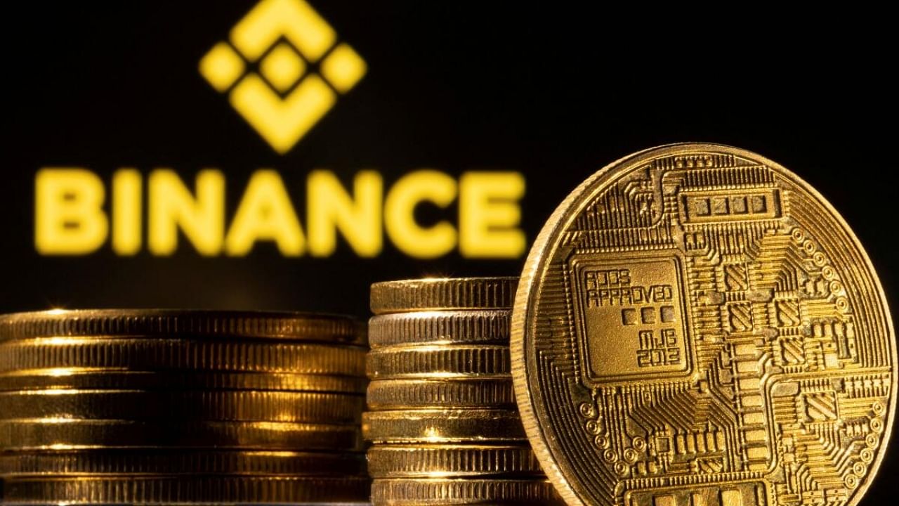 A representation of the cryptocurrency is seen in front of Binance logo in this illustration. Credit: Reuters Photo
