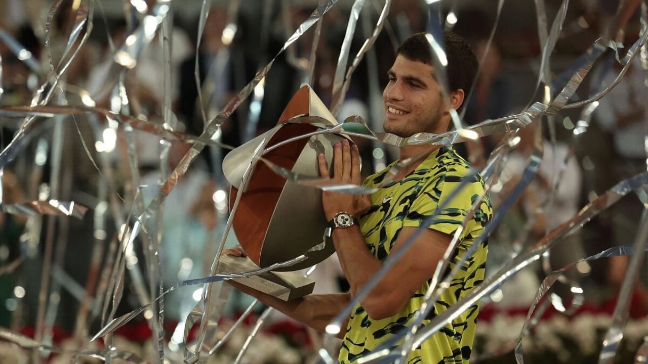 Carlos Alcaraz with the Madrid Open trophy. Credit: AFP Photo