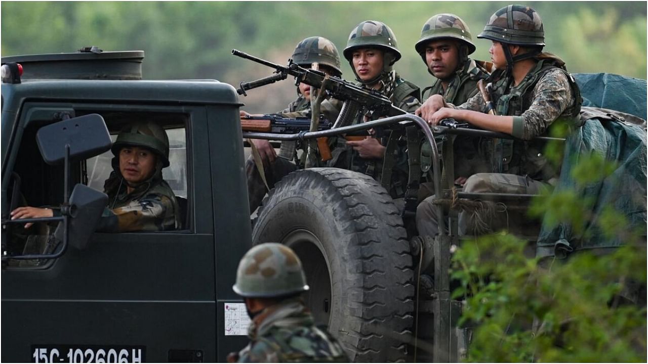 Indian Army servicemen patrol a violence-hit area in Manipur. Credit: AFP Photo
