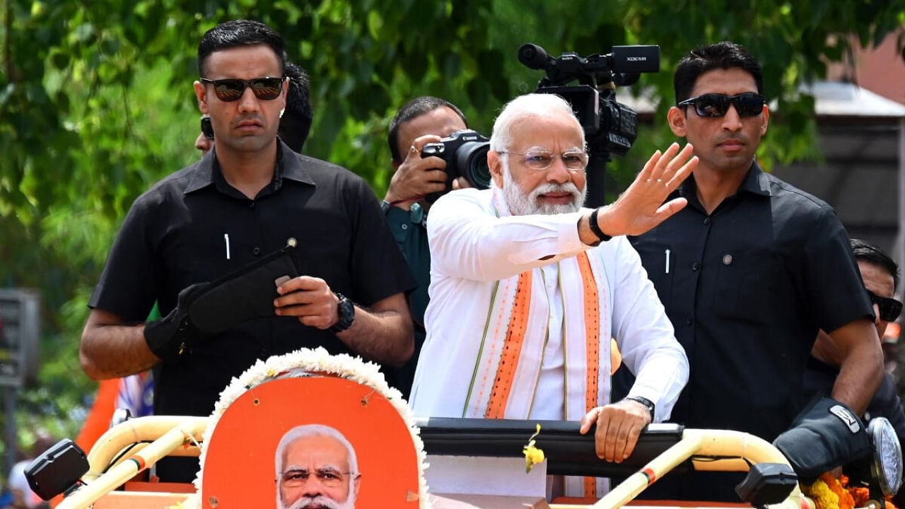 PM Modi on his roadshow in Bengaluru. Credit: DH Photo/Pushkar V