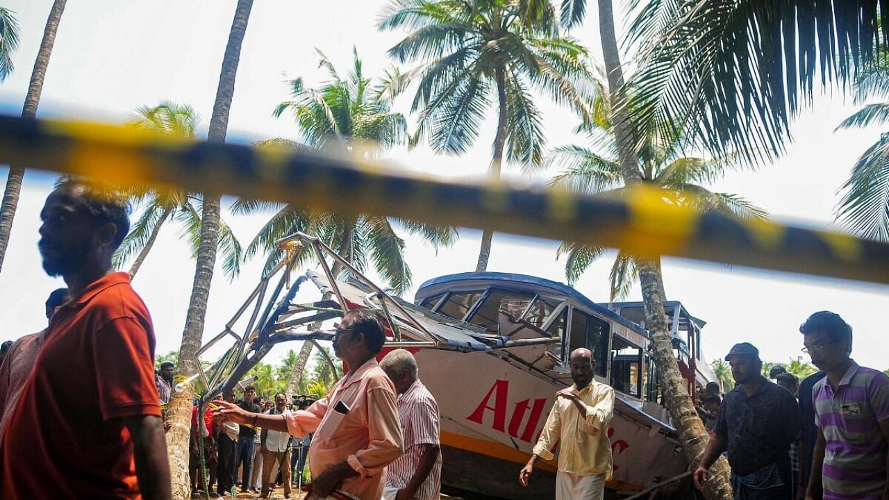 Onlookers gather near the site of a boat accident in Tanur, in Malappuram. Crediit: AFP Photo