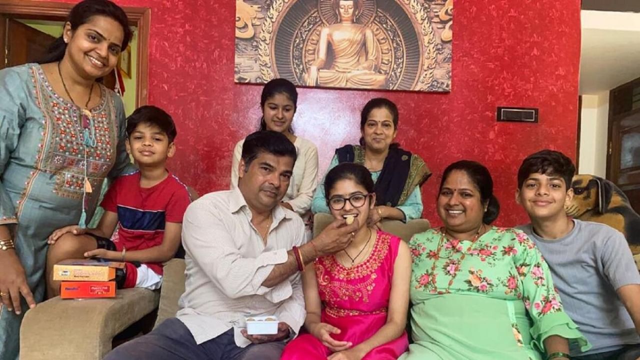 Parents feed a sweet to Bhoomika R Pai at her grandmother's house at Katpadi. Credit: Special Arrangement
