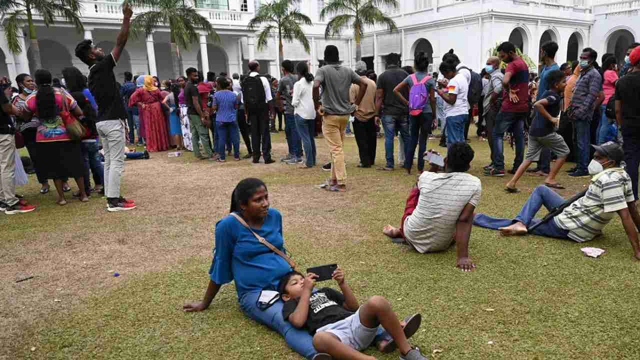 People gather to visit Sri Lankan President Gotabaya Rajapaksa's official residence in Colombo on July 11, 2022, after it was overrun by anti-government protestors. - Millions of rupees in cash left behind by Sri Lanka's president when he fled his official residence was handed over to a court on July 11 after being turned in by protestors, police said as a succession battle got under way.  Credit: AFP Photo