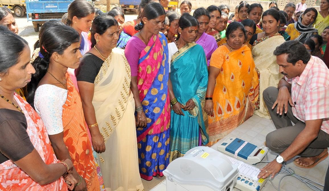 Election officer conducting demo to voter on how the EVM works. Credit: Special Arrangements