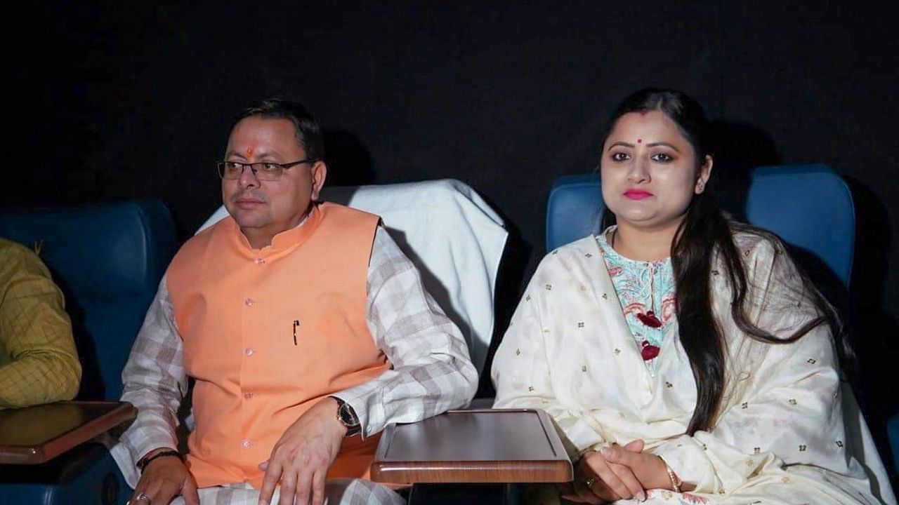Uttarakhand Chief Minister Pushkar Singh Dhami watches the film 'The Kerala Story' with his wife Geeta Dhami, in Dehradun. Credit: PTI Photo