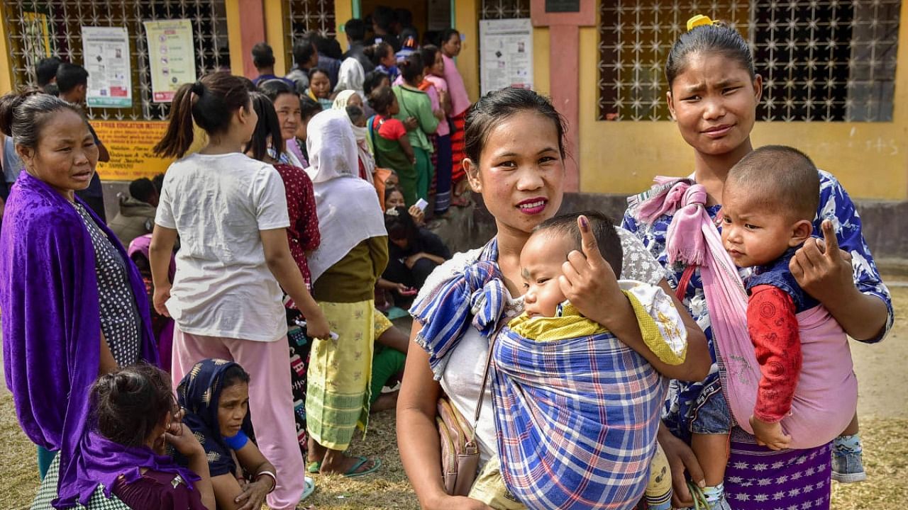 Women voters show their fingers marked with indelible ink after casting their votes at a polling booth during the Meghalaya Assembly elections, in Ri Bhoi district, Monday, Feb. 27, 2023. Credit: PTI Photo