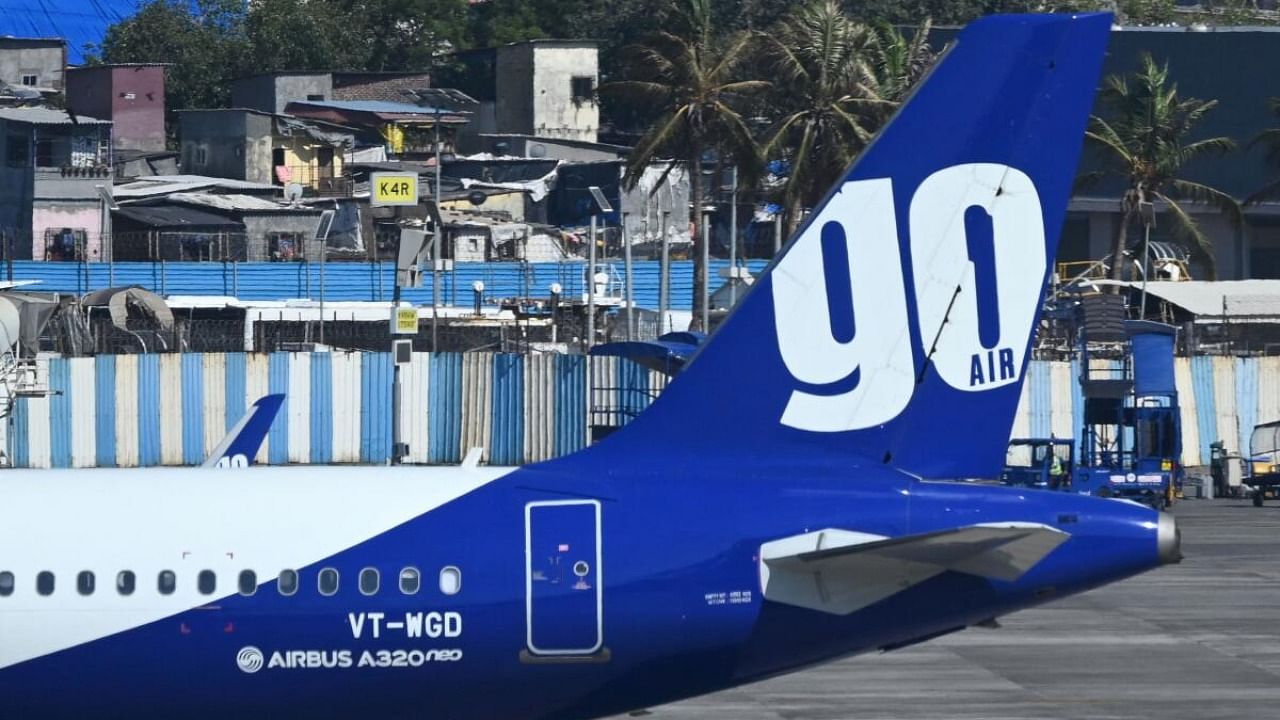 A Go First airline aircraft, formerly known as GoAir, is seen parked at the apron of the Mumbai International airport on May 3, 2023. Credit: AFP Photo
