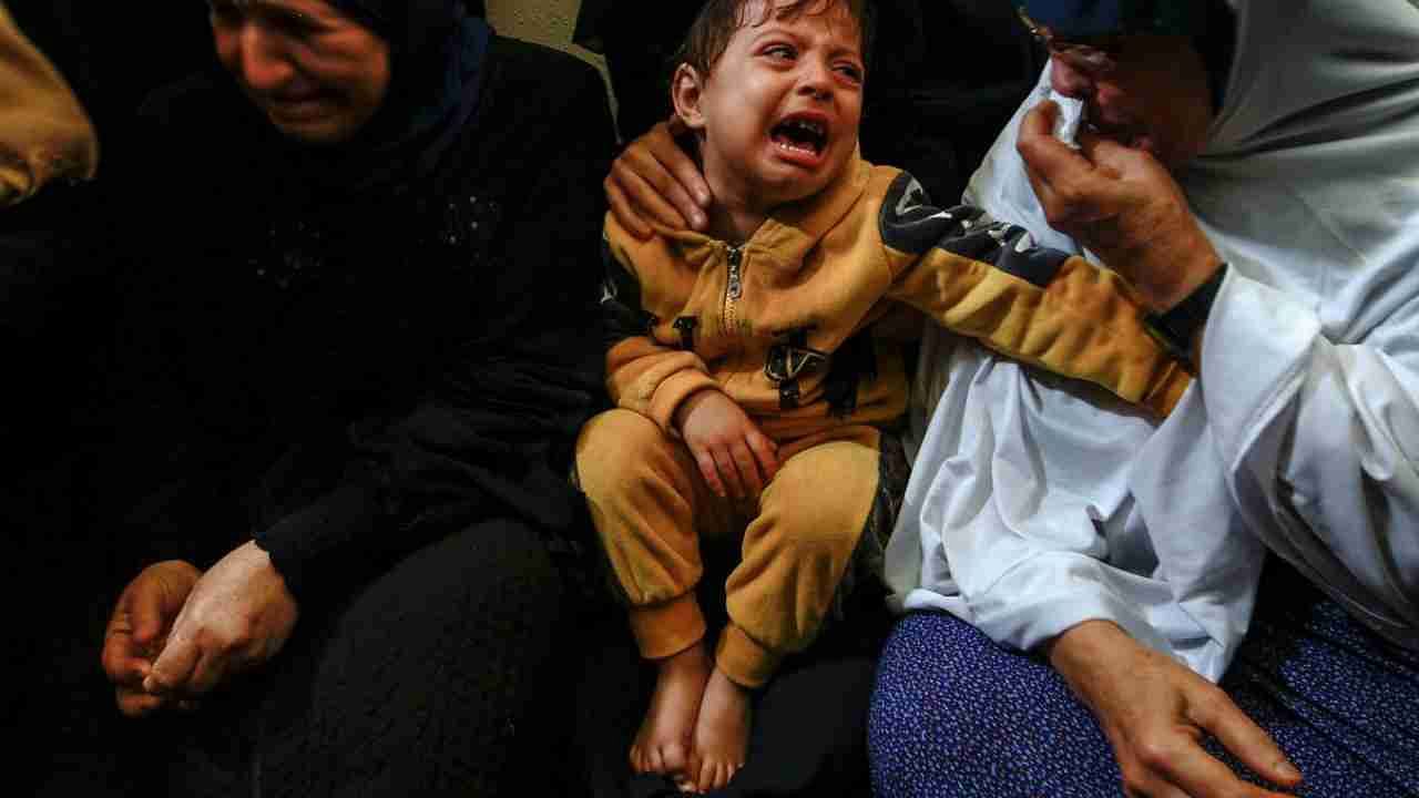 A child reacts as mourners attend the funeral of Islamic Jihad commander Ali Ghali and his brother Mahmoud who were killed in an Israeli strike, in Khan Younis in the southern Gaza Strip May 11, 2023.  Credit: Reuters Photo