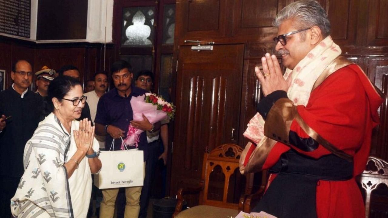 West Bengal Chief Minister Mamata Banerjee with newly appointed Chief Justice of the High Court, T.S. Sivagnanam , in Kolkata, on Thursday, May 11, 2023. Credit: IANS Photo