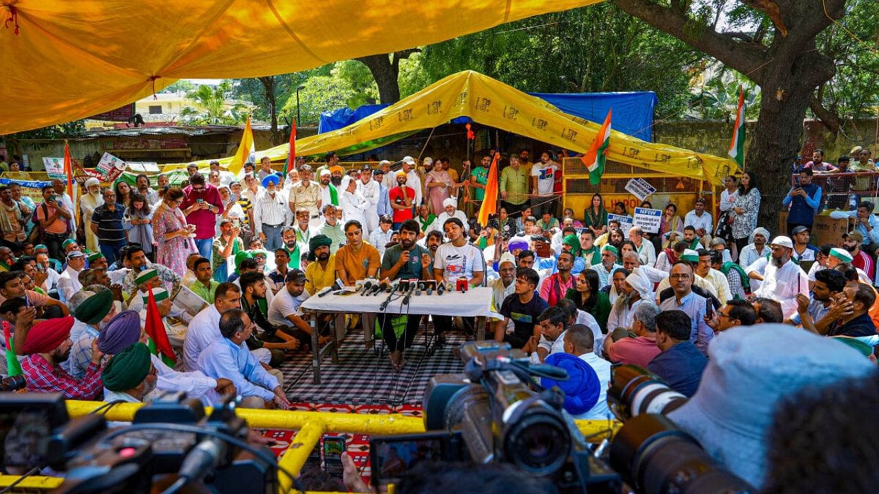 Wrestlers Bajrang Punia, Vinesh Phogat and Sakshi Malik address a press conference during their ongoing protest against Wrestling Federation of India (WFI) chief Brij Bhushan Sharan Singh, at Jantar Mantar in New Delhi, Wednesday, May 10, 2023. Credit: PTI Photo