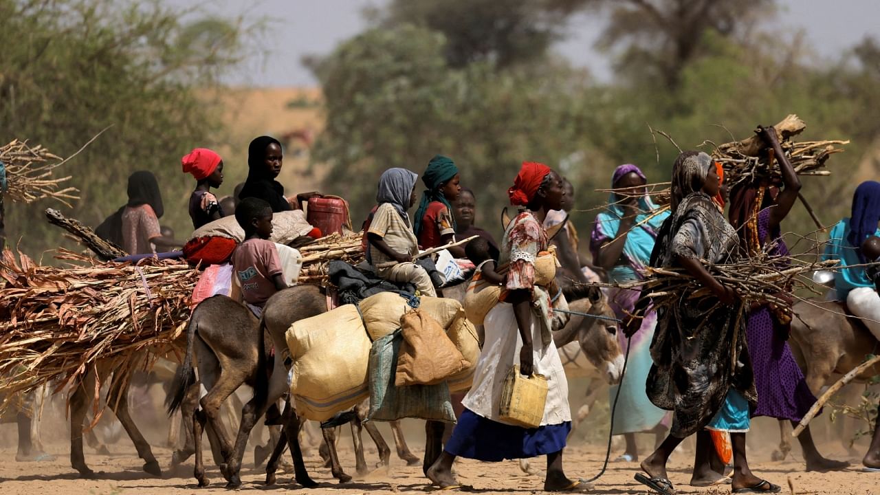 Sudanese refugees who fled the violence in Sudan's Darfur region and newly arrived ride their donkeys looking for space to temporarily settle, near the border between Sudan and Chad in Goungour, Chad, May 8, 2023. Credit: Reuters File Photo