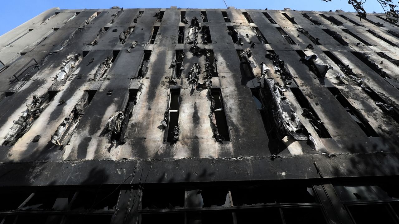 A view of a Radio Pakistan office building after it was set afire by the supporters of Pakistan's former Prime Minister Imran Khan during a protest against his arrest, in Peshawar, Pakistan, May 11, 2023. Credit: Reuters Photo