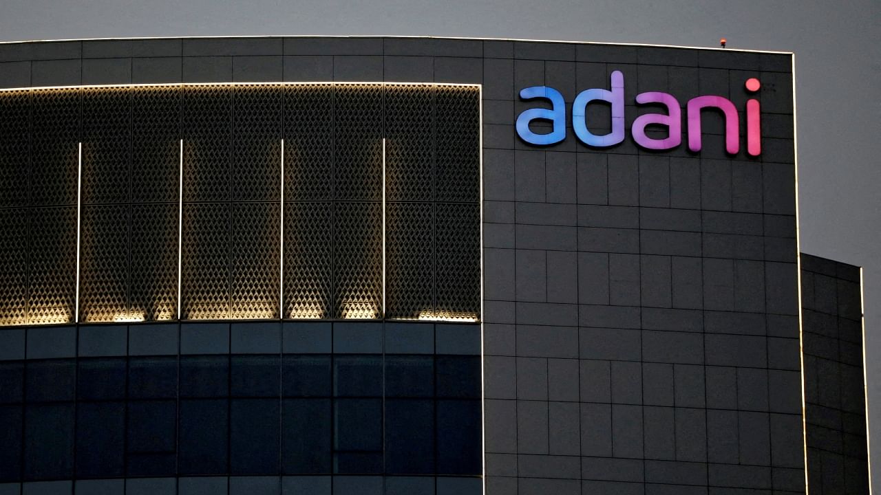 The logo of the Adani group is seen on the facade of one of its buildings on the outskirts of Ahmedabad, India, April 13, 2021. Credit: Reuters File Photo