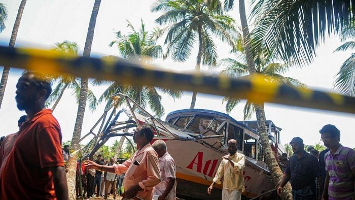 Onlookers gather near the site of the boat accident in Tanur, in Malappuram. Credit: AFP Photo 