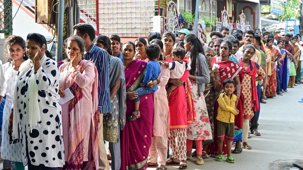A long queue of voters waiting to exercise their franchise in Bengaluru on Wednesday. DH File Photo