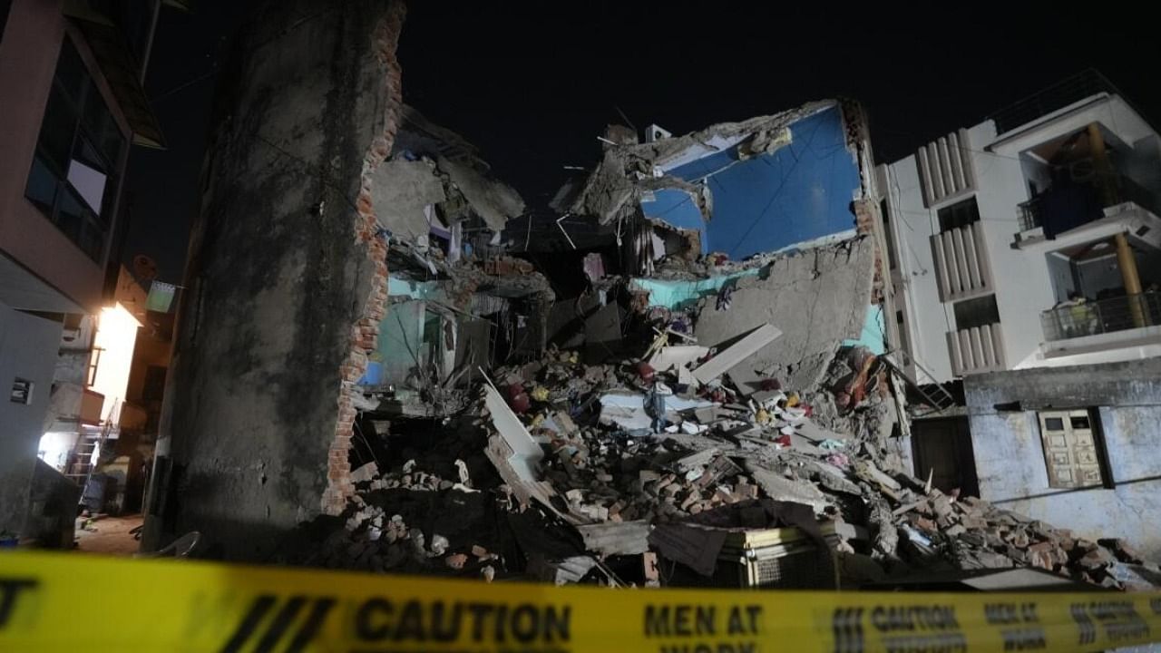 Rubble of a three-storey building after its collapse, in Ahmedabad. Credit: IANS Photo