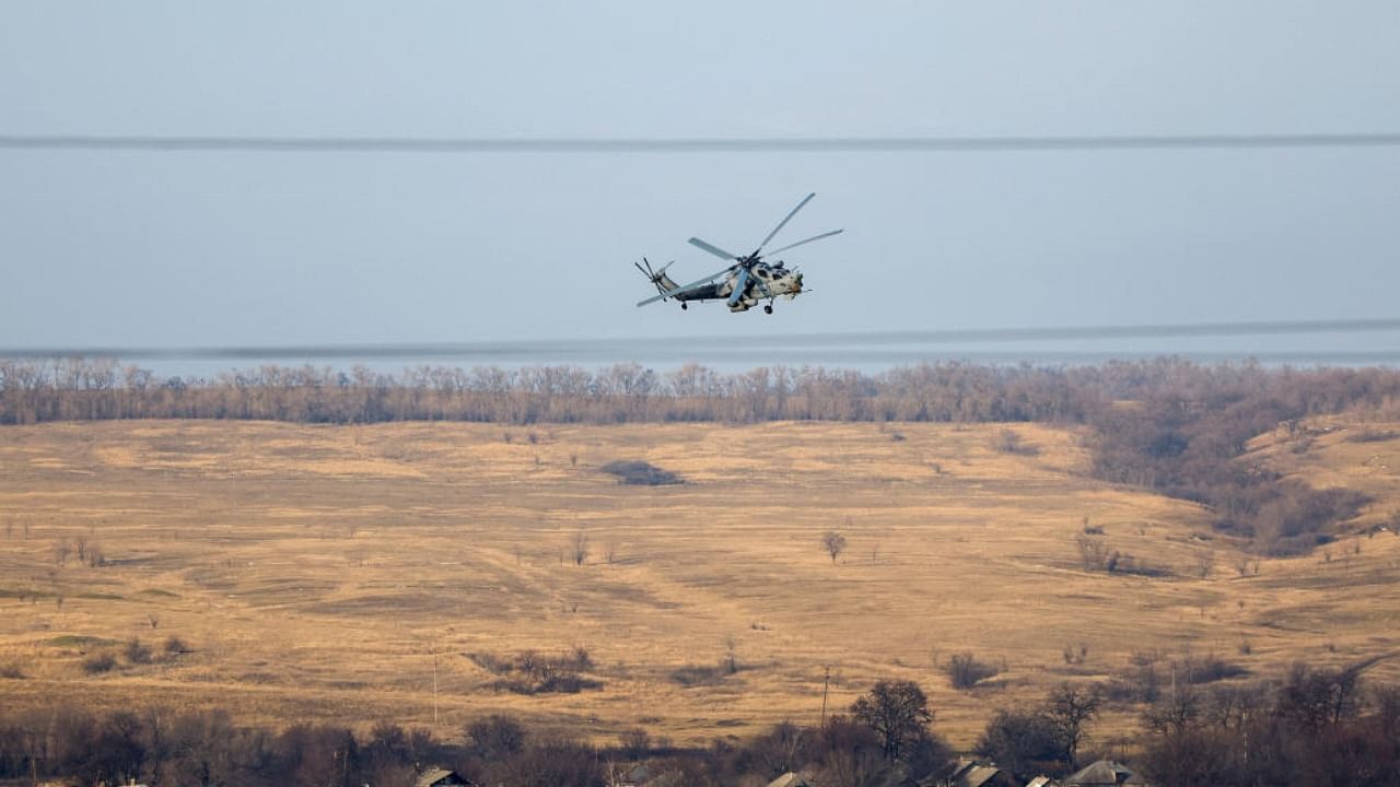 A Russian Mi-28 military helicopter flies in the Luhansk region. Credit: Reuters Photo
