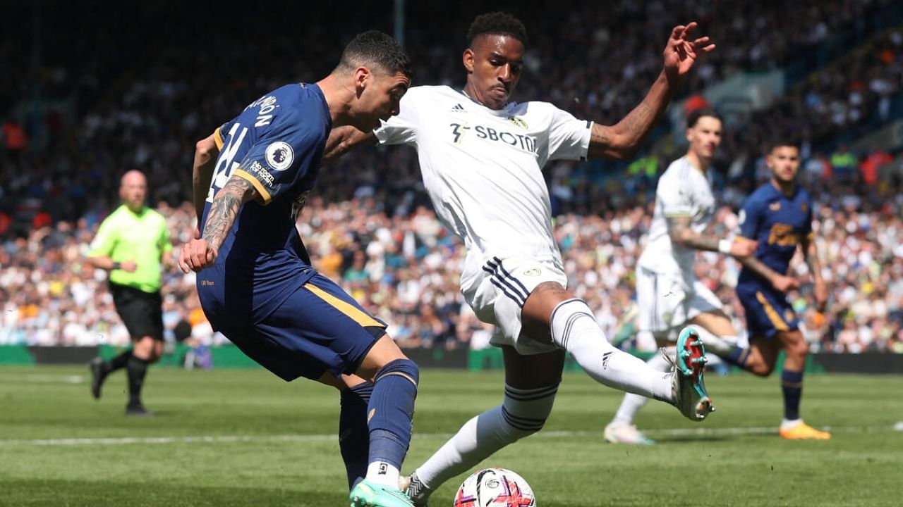 Newcastle United's Miguel Almiron in action with Leeds United's Junior Firpo. Credit: Reuters Photo