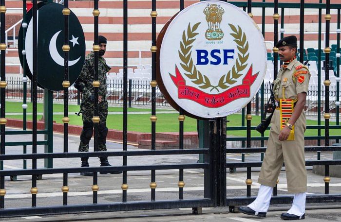 BSF and Pakistani Rangers soliders stand guard at Attari-Wagah international border. Credit: AFP File Photo  