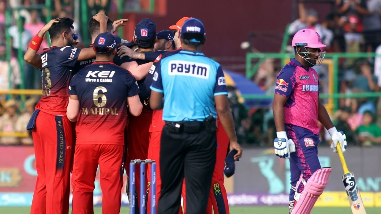 RCB players celebrate the dismissal of RR's captain Sanju Samson during the IPL 2023 match between Royal Challengers Bangalore and Rajasthan Royals at Sawai Mansingh Stadium in Jaipur on Sunday, May 14, 2023. Credit: IANS Photo