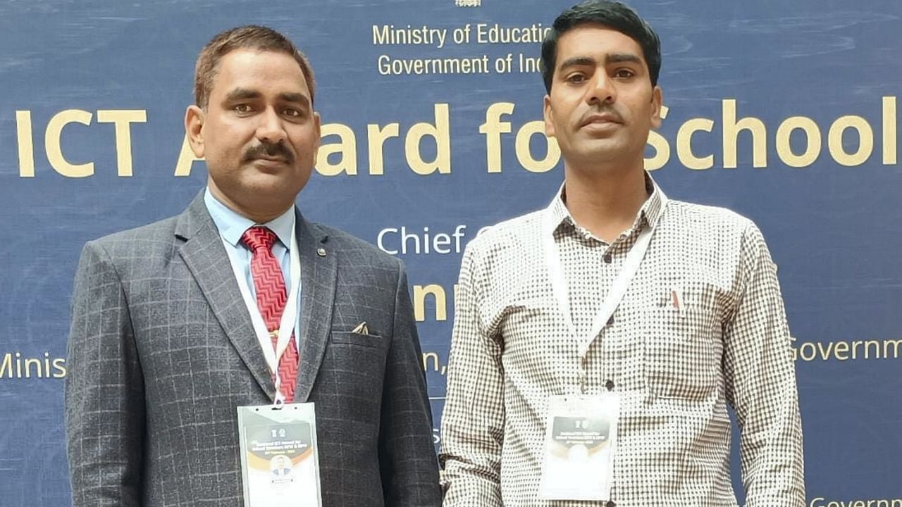 Rajasthan government employees Suresh Ola (left) and Surendra Tetarwal, who have developed more than 250 mobile applications in eight years to provide study material in Hindi to rural students free of charge.  Credit: PTI Photo