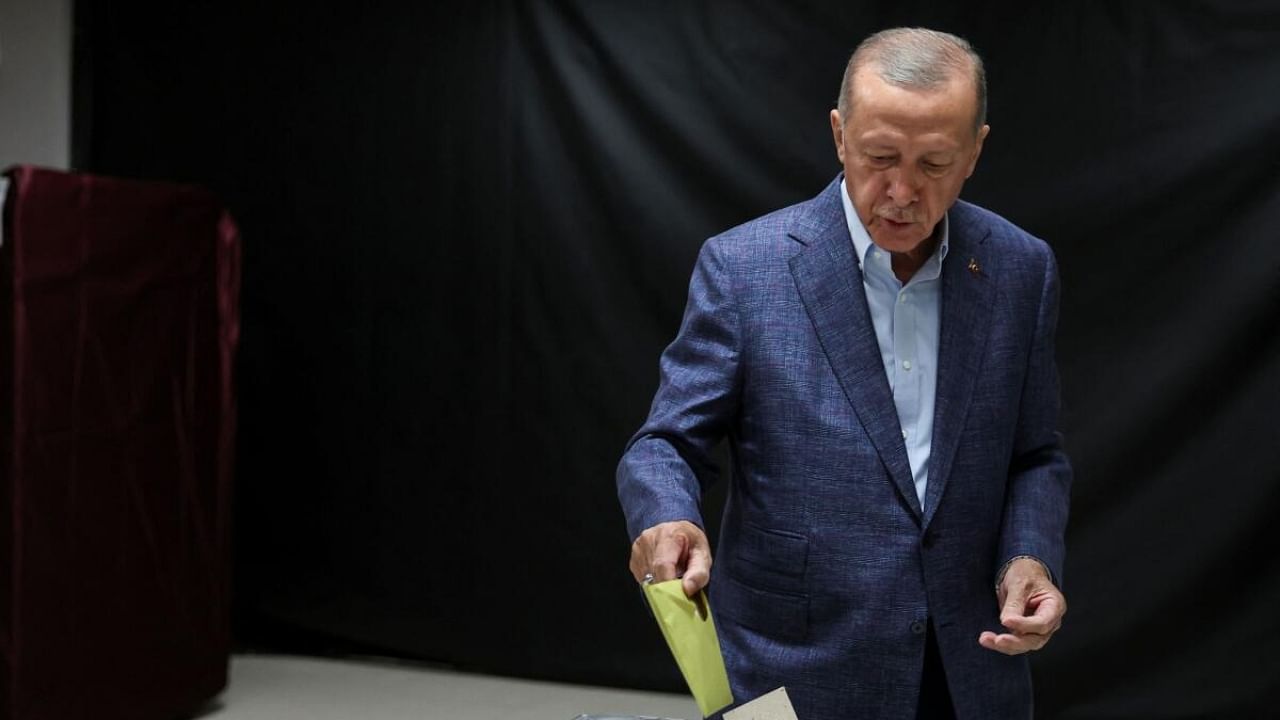 Turkish President Tayyip Erdogan casts a ballot at a polling station in Istanbul, Turkey May 14, 2023. Credit: Reuters Photo