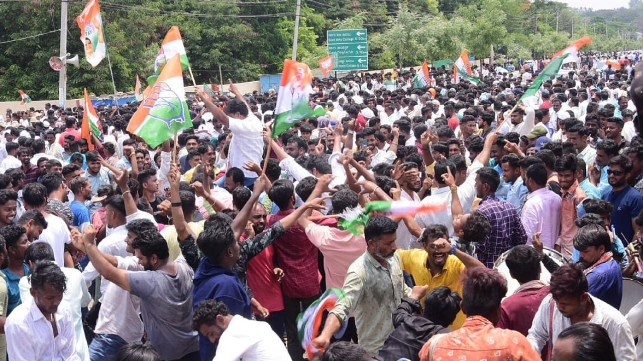ongress workers celebrate the victory of party candidate K C Veerendra in Chitradurga.