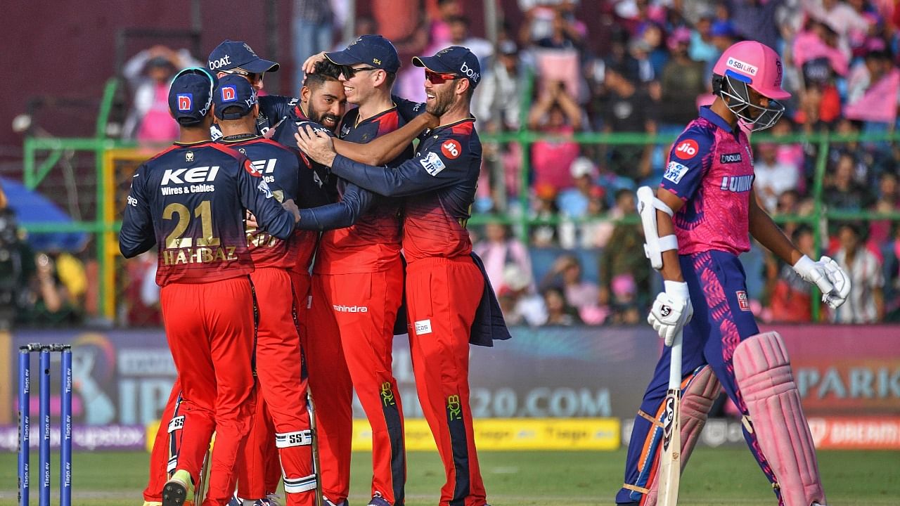 RCB players celebrate the wicket of Yashasvi Jaiswal. Credit: PTI Photo