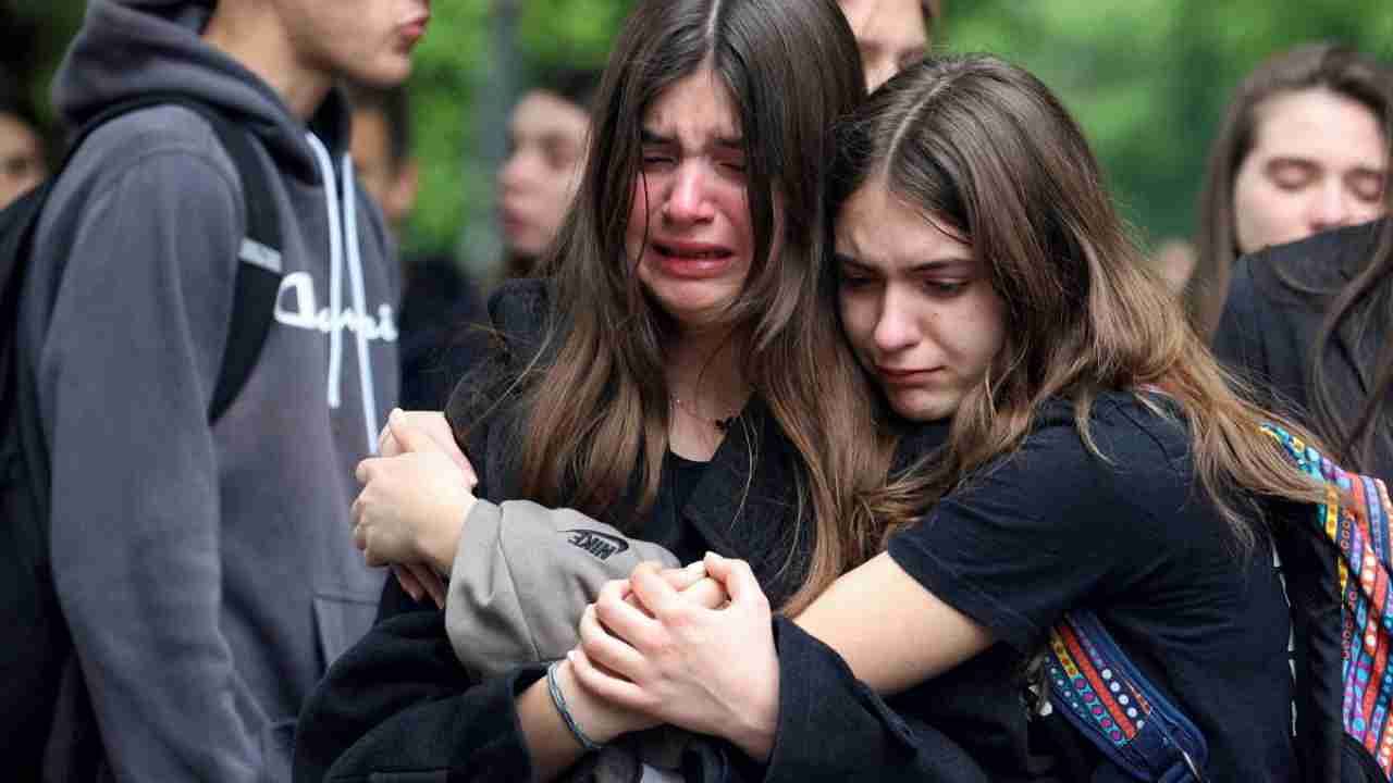 People react as they pay tribute following a school mass shooting, after a boy opened fire on others, killing fellow students and staff, in Belgrade, Serbia May 4, 2023. Credit: Reuters Photo
