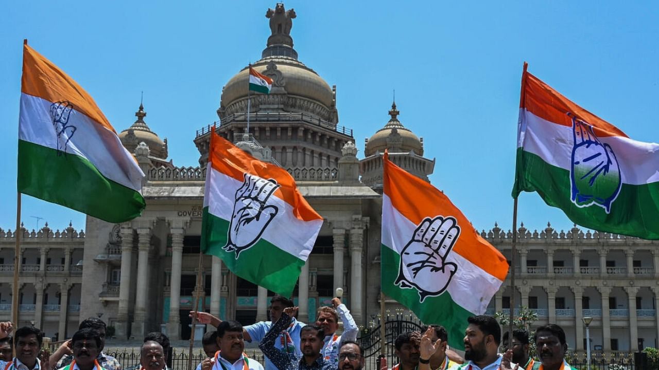 Congress members celebrate election win in front of the Vidhana Soudha in Bengaluru on Sunday, May 14, 2023. DH Photo/S K Dinesh