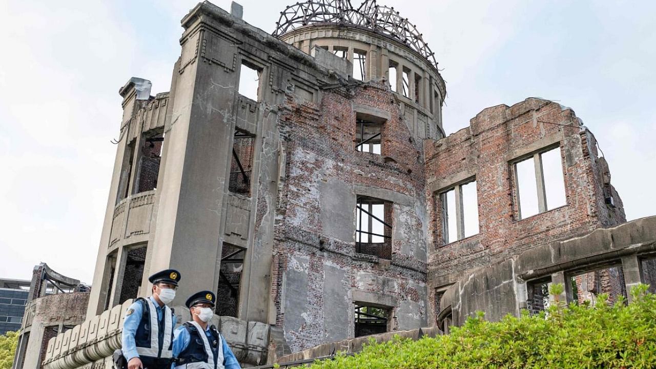Cops patrol past the Atomic Bomb dome in Hiroshima. Credit: AFP File Photo