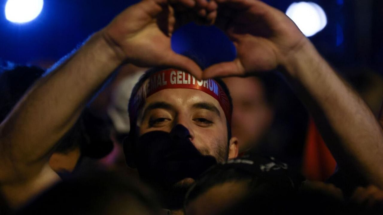 A supporter of Kemal Kilicdaroglu, presidential candidate of Turkey's main opposition alliance, gestures at a rally outside the Republican People's Party (CHP) headquarters in Ankara. Credit: Reuters Photo