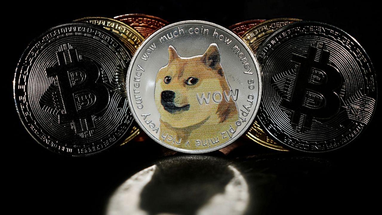 Representations of cryptocurrencies Bitcoin and Dogecoin are seen in this picture illustration. Credit: Reuters File Photo