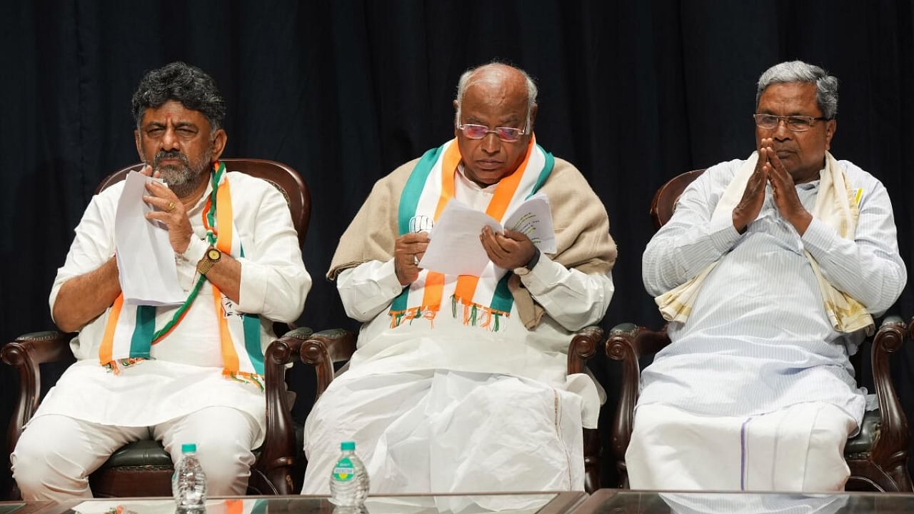 Congress President Mallikarjun Kharge with former Karnataka CM Siddaramaiah and Karnataka Congress President D.K. Shivakumar. Credit: PTI Photo