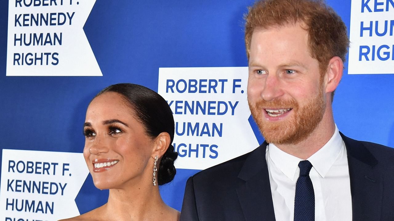Britain's Prince Harry and his wife Meghan. Credit: AFP Photo