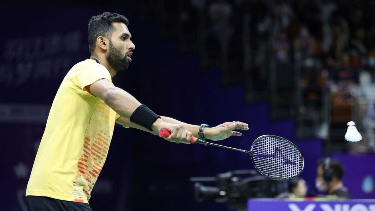 HS Prannoy of India hits a return to Chou Tien-chen of Taiwan during their men's singles match at the Sudirman Cup Finals 2023 world badminton championships in Suzhou, in China's eastern Jiangsu province on May 14, 2023. Credit: AFP Photo