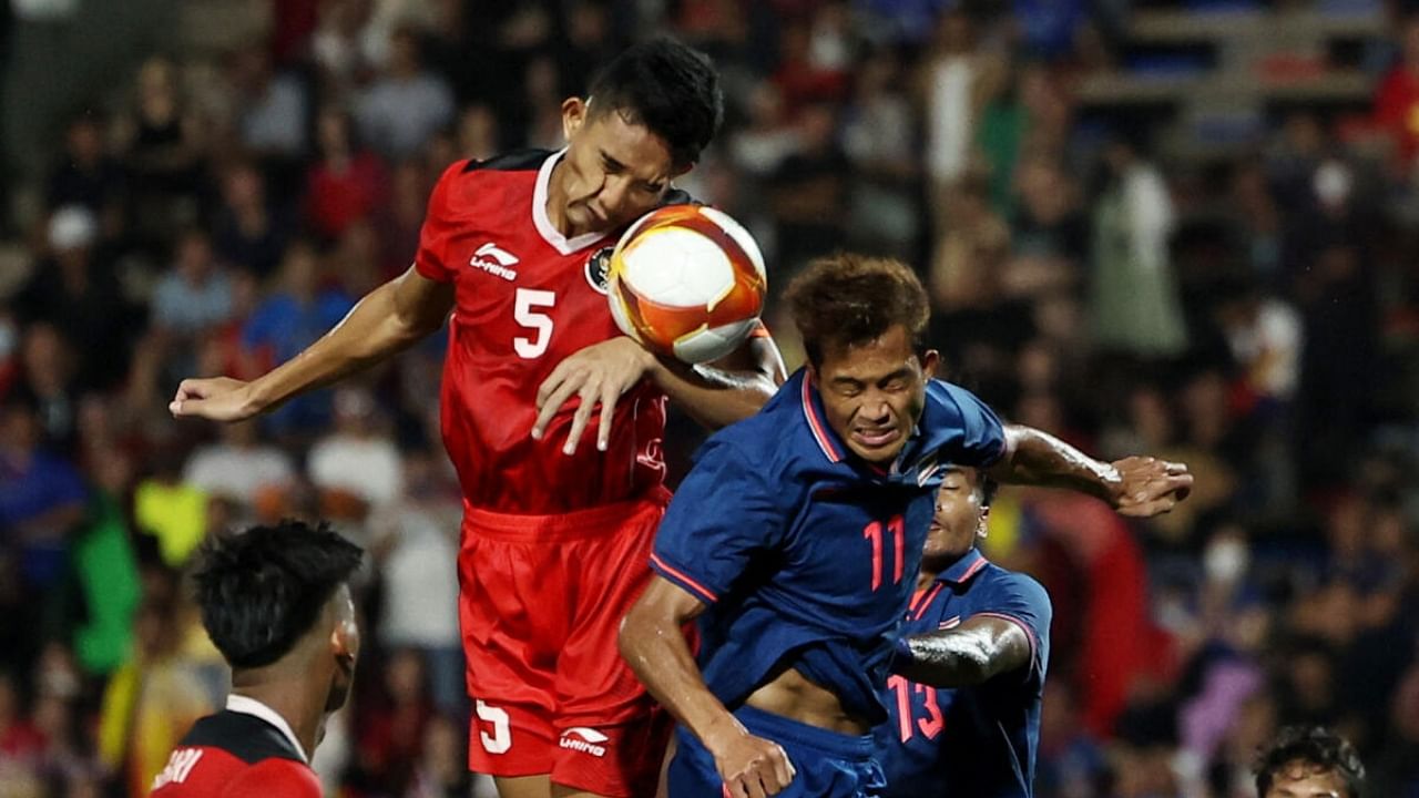 Thailand's Anan Yodsangwal in action with Indonesia's Rizky Ridho Ramadhani. Credit: Reuters Photo