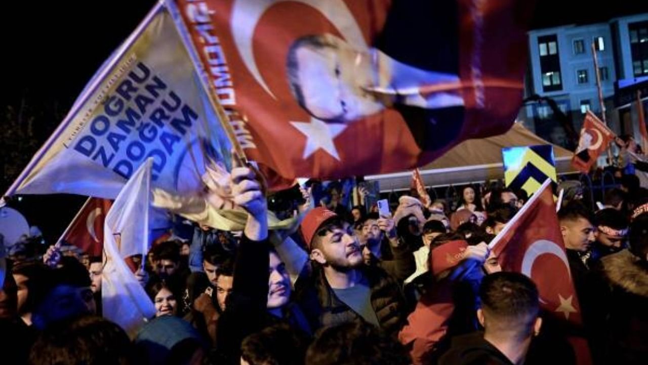 Erdogan's supporters celebrate after end of polling in what was initially thought to be a close contest. Credit: AFP Photo