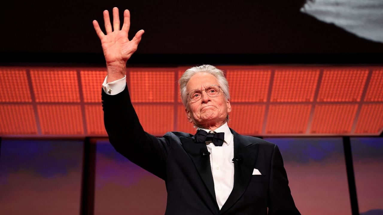 US actor Michael Douglas gestures on stage as he speaks after he received the Honorary Palme d’or of he 76th Cannes Film Festival during the opening ceremony in Cannes. Credit: AFP Photo