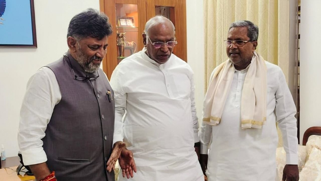 Congress President Mallikarjun Kharge with senior party leaders Siddaramaiah and DK Shivakumar during a meeting. Credit: IANS Photo