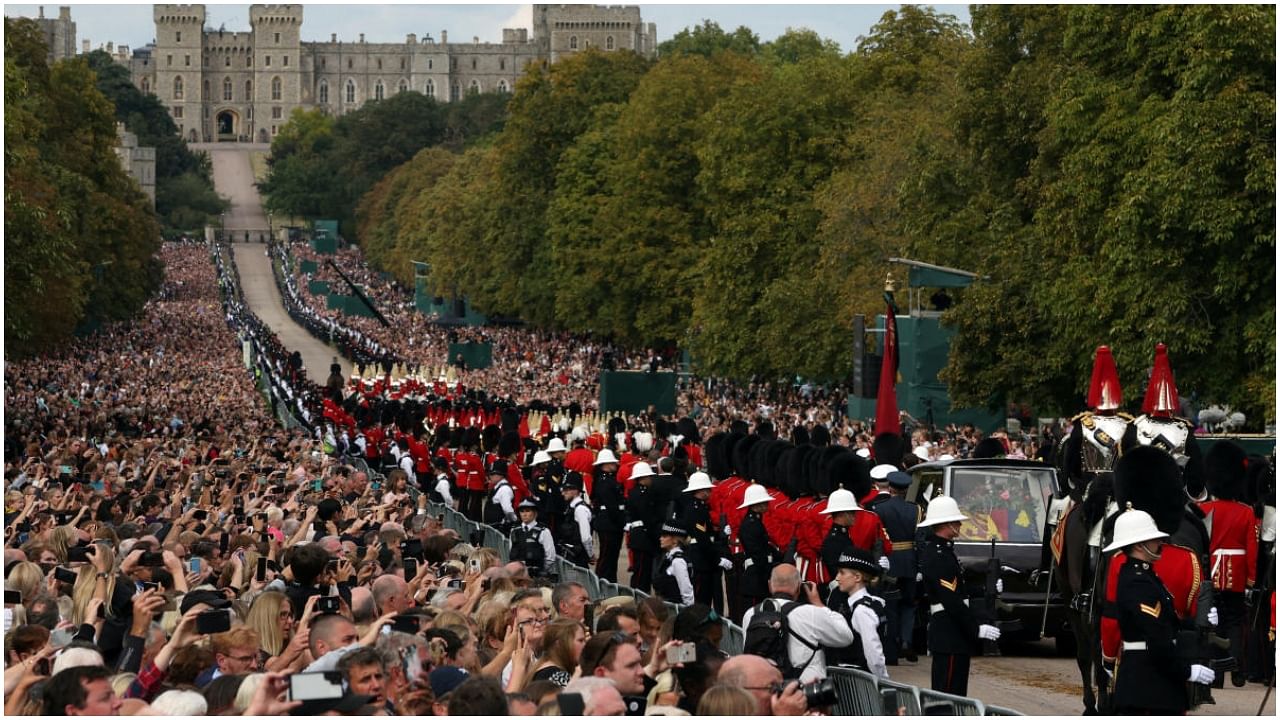 The hearse carrying the coffin of Britain's Queen Elizabeth is escorted along the Long Walk towards Windsor castle in the funeral procession, on the day of the state funeral and burial of Britain's Queen Elizabeth, in Windsor, Britain, September 19, 2022. Credit: Reuters Photo