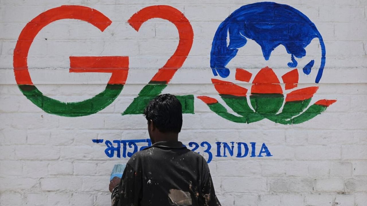 G20 being painted on a Srinagar wall ahead of the event. Credit: AFP Photo