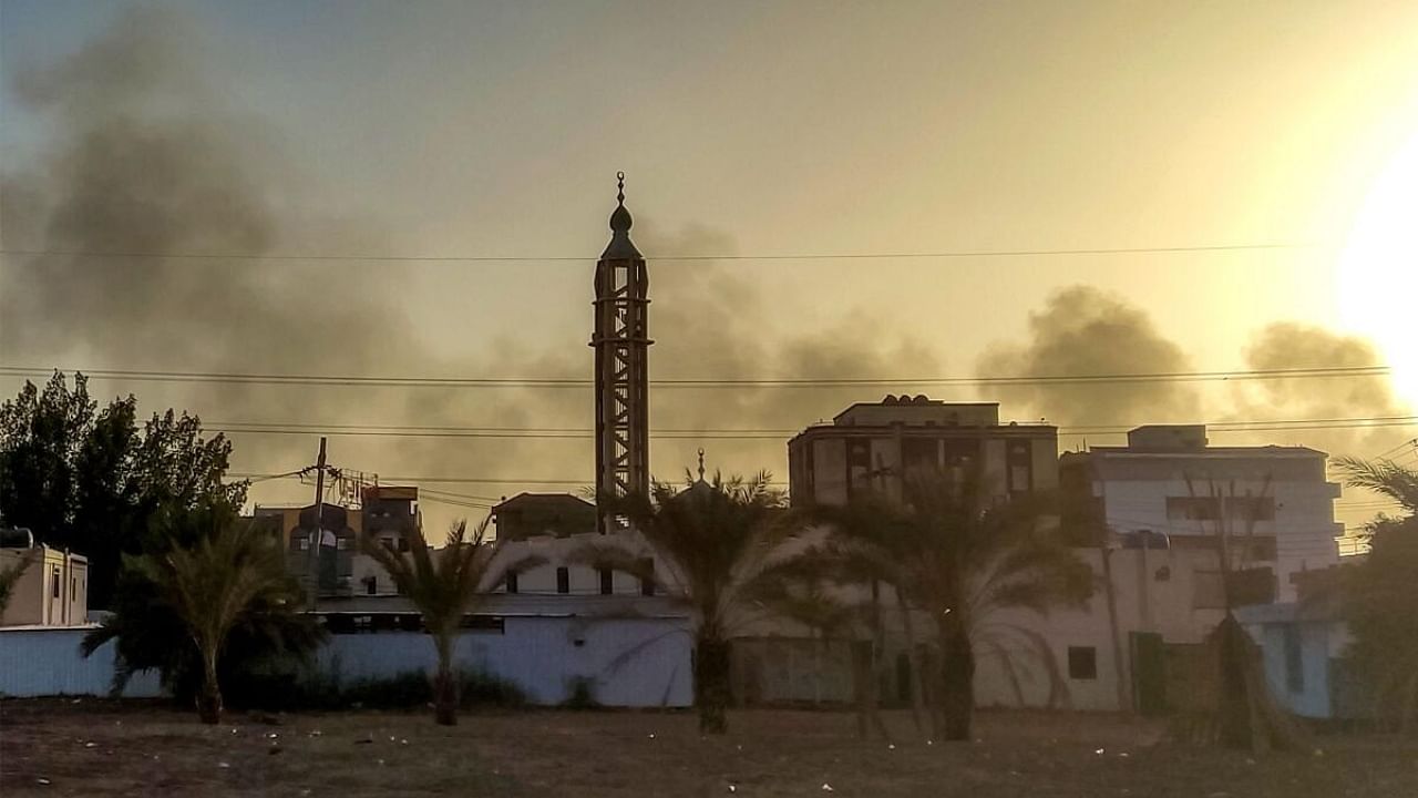 Smoke rises above buildings in southern Khartoum, as violence between two rival Sudanese generals continues. Credit: AFP Photo