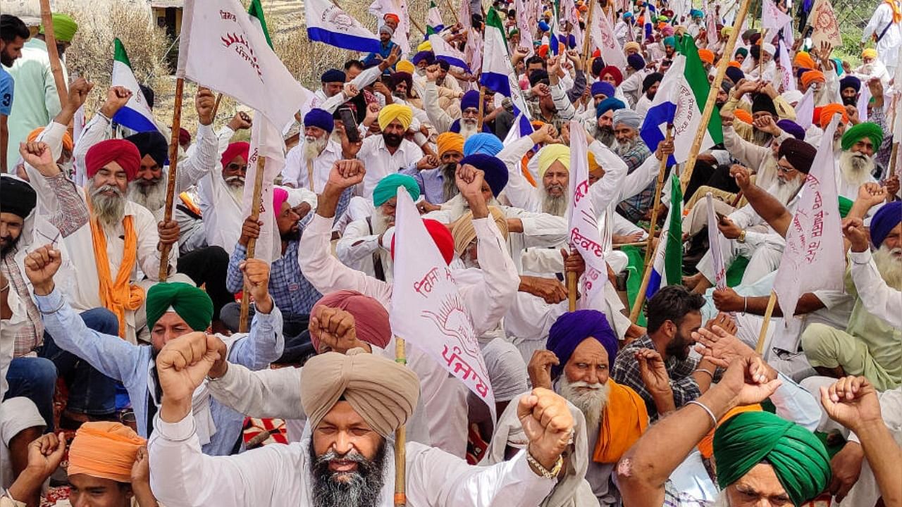 Farmers of Kisan Mazdoor Sangharsh Committee (KMC) block a railway track over alleged inadequate compensation for the land acquired for the Bharatmala project, in Devi Dass Pura village, near Amritsar, Thursday, May 18, 2023. Credit: PTI Photo