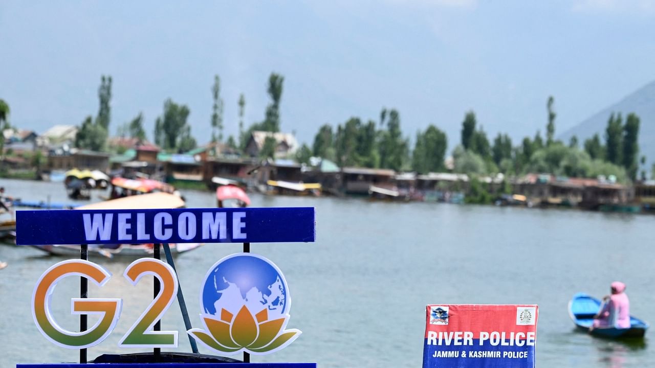 A G20 logo is pictured on a boat in Dal Lake ahead of the G20 meeting in Srinagar, May 19, 2023. Credit: AFP Photo